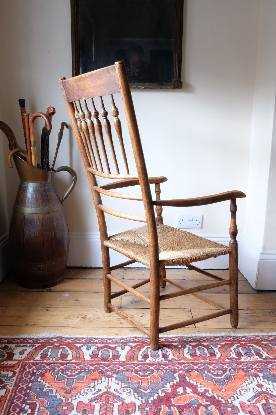 Back view os a Philip Clissett Arts & Crafts Ash Rush Seat Spindle Back Armchair Circa 1890