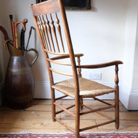 Back view os a Philip Clissett Arts & Crafts Ash Rush Seat Spindle Back Armchair Circa 1890