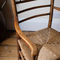 Serpentine arm of a Philip Clissett Arts & Crafts Ash Rush Seat Spindle Back Armchair Circa 1890