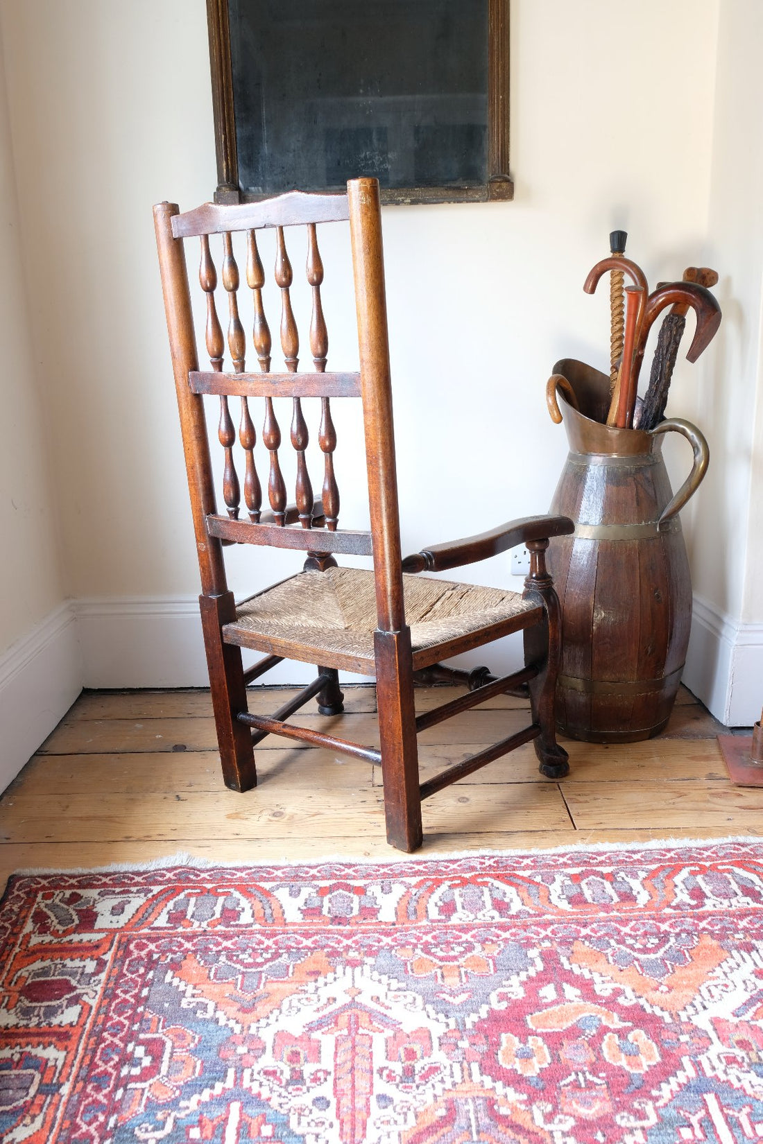 Rear view of antique Lancashire spindle back armchair showing double rows of turned spindles