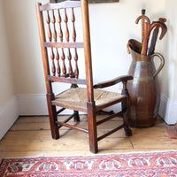 Rear view of antique Lancashire spindle back armchair showing double rows of turned spindles