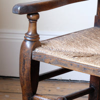 baluster-turned leg with a pad foot on a Antique Lancashire Oak Spindle Back Armchair with Rush Seat, 19th Century North Country Chair
