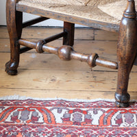 ball-turned stretcher on aa Antique Lancashire Oak Spindle Back Armchair with Rush Seat, 19th Century North Country Chair