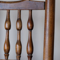 close up of the double baluster spindles back support on an Antique Lancashire Oak Spindle Back Armchair with Rush Seat, 19th Century North Country Chair