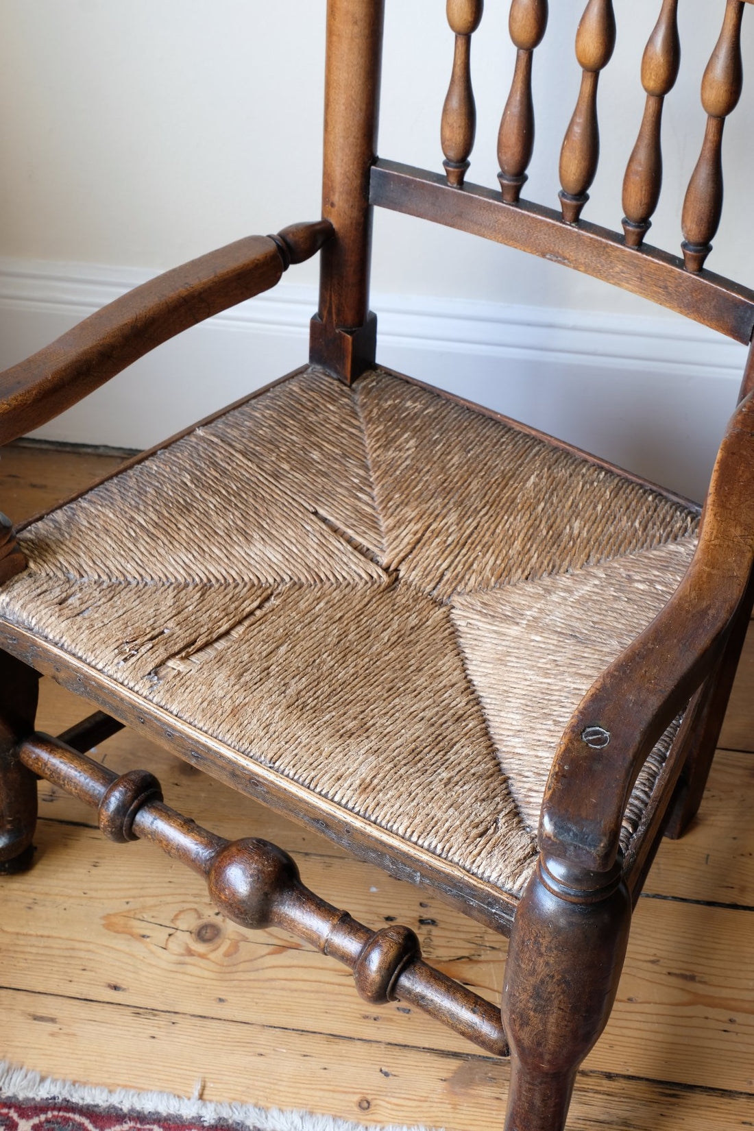 Rush seat on an Antique Lancashire Oak Spindle Back Armchair with Rush Seat, 19th Century North Country Chair
