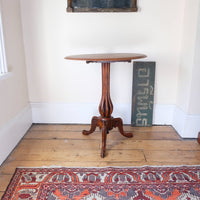 Late Victorian mahogany oval tilt-top tripod table with open reed column detail