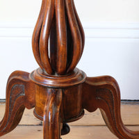 Tripod base os a Late Victorian mahogany oval tilt-top tripod table with open reed column detail