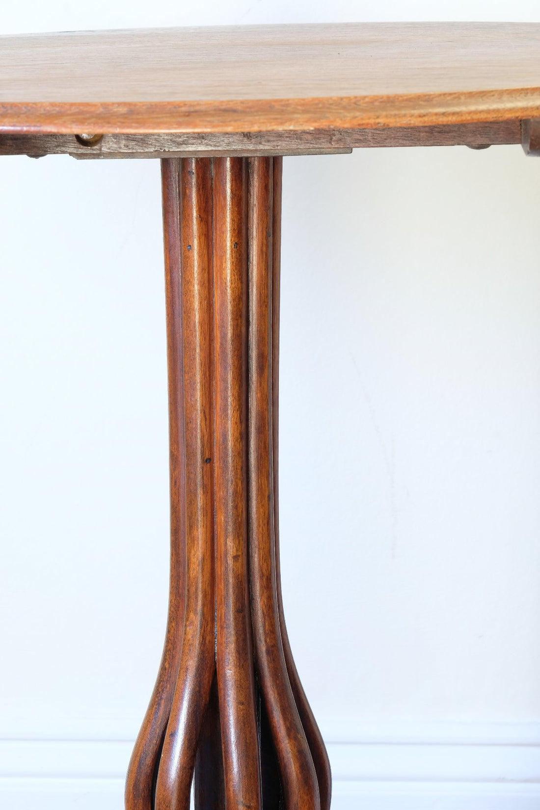 Late Victorian mahogany oval tilt-top tripod table with open reed column detail