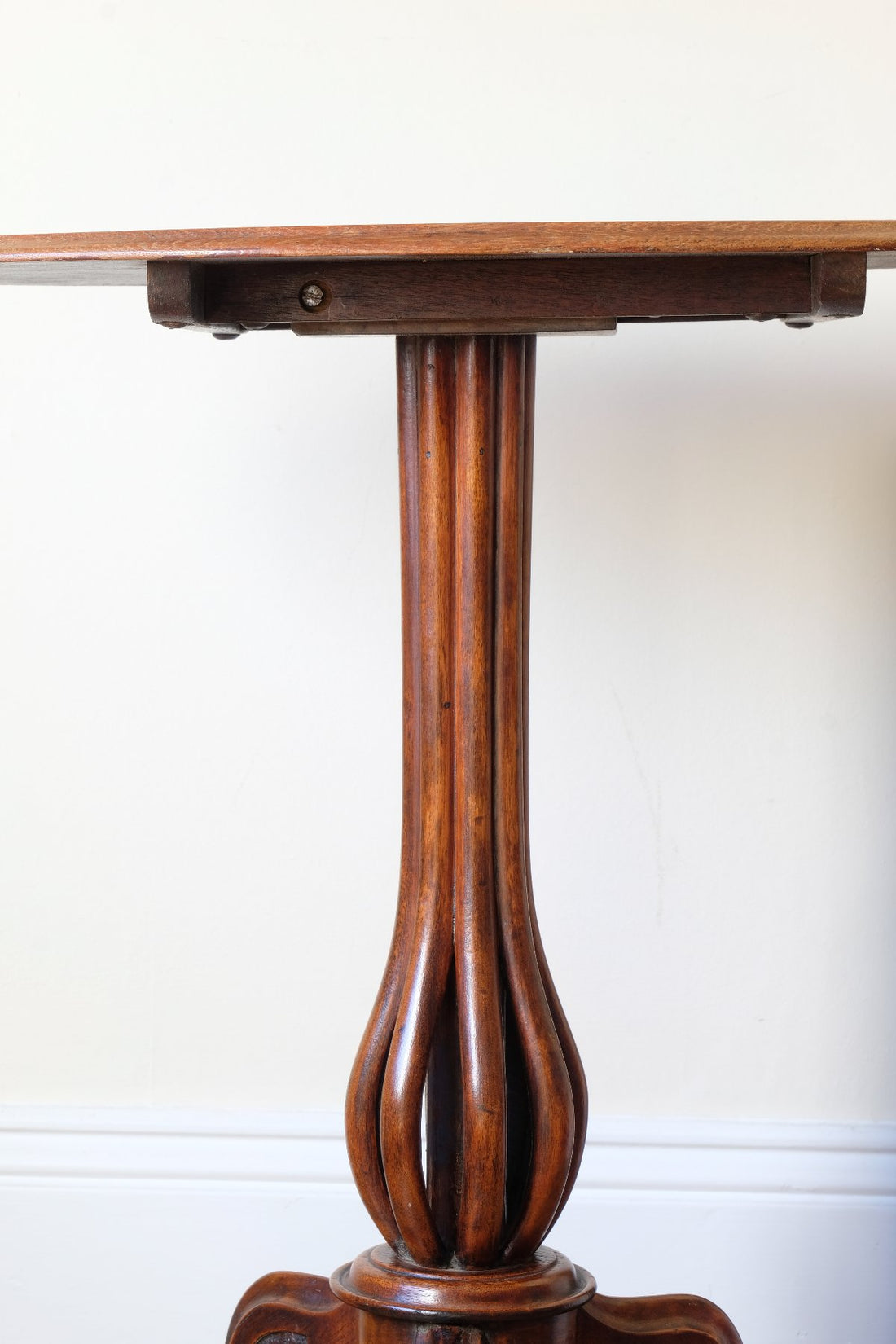 Late Victorian mahogany oval tilt-top tripod table with open reed column detail