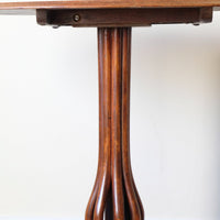Late Victorian mahogany oval tilt-top tripod table with open reed column detail