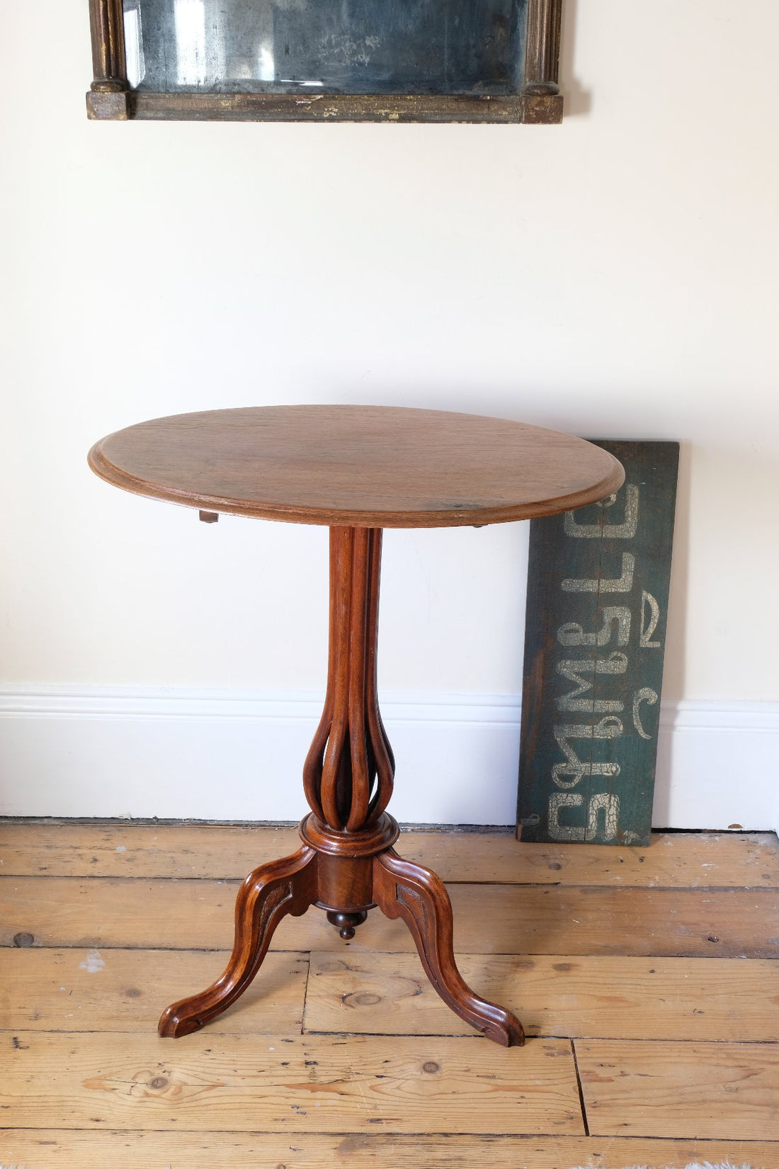 Late Victorian mahogany oval tilt-top tripod table with open reed column detail