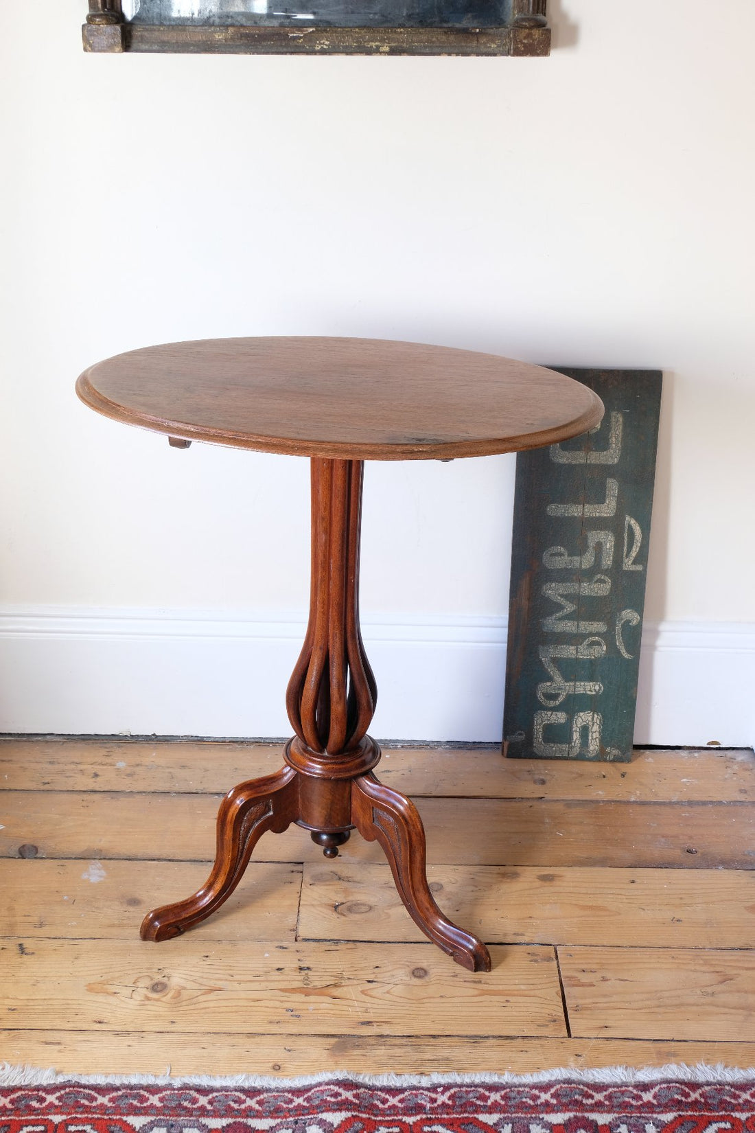 Late Victorian mahogany oval tilt-top tripod table with open reed column detail
