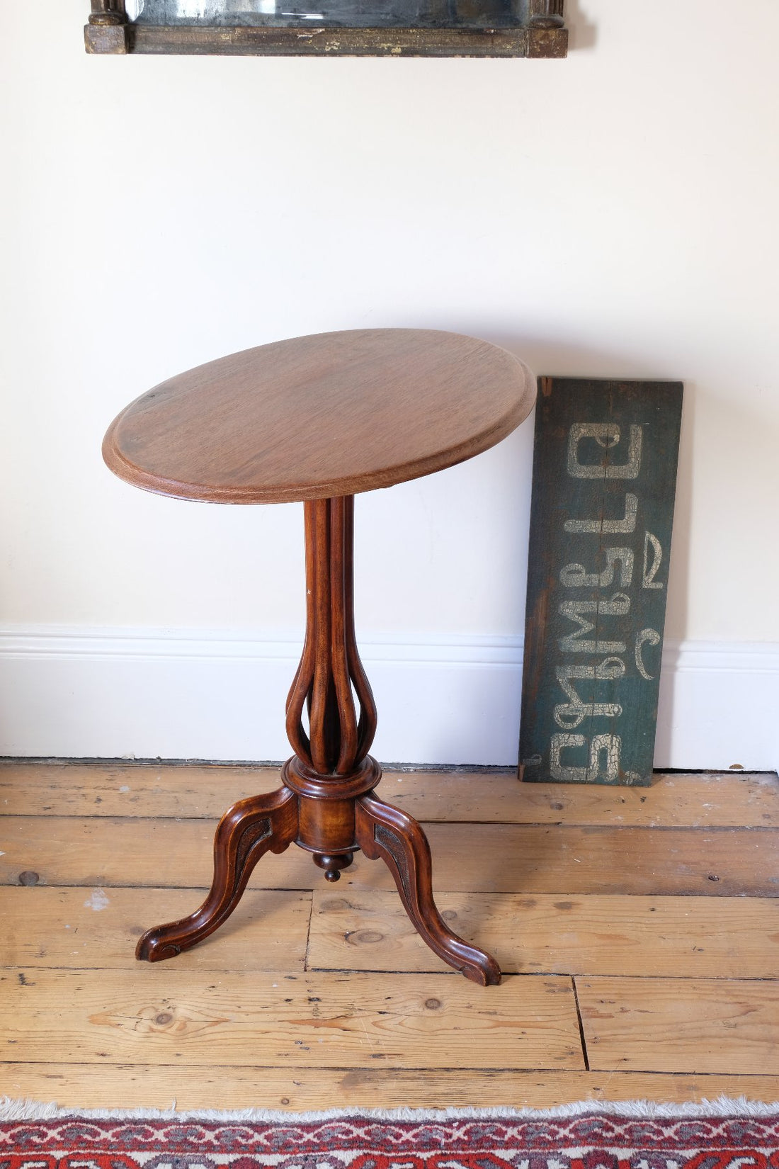 Late Victorian mahogany oval tilt-top tripod table with open reed column detail