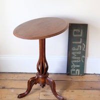Late Victorian mahogany oval tilt-top tripod table with open reed column detail