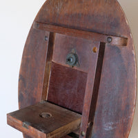 brass latch on a Late Victorian mahogany oval tilt-top tripod table with open reed column detail