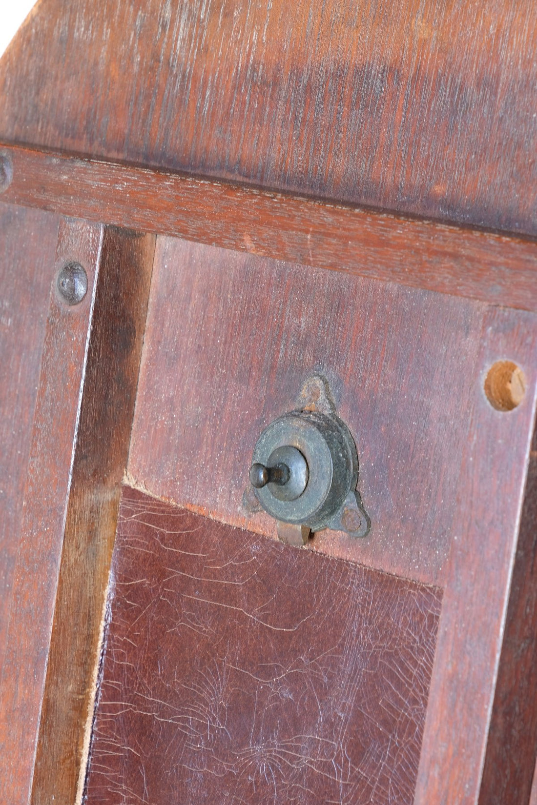 Brass ltach on a Late Victorian mahogany oval tilt-top tripod table with open reed column detail