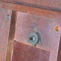 Brass ltach on a Late Victorian mahogany oval tilt-top tripod table with open reed column detail