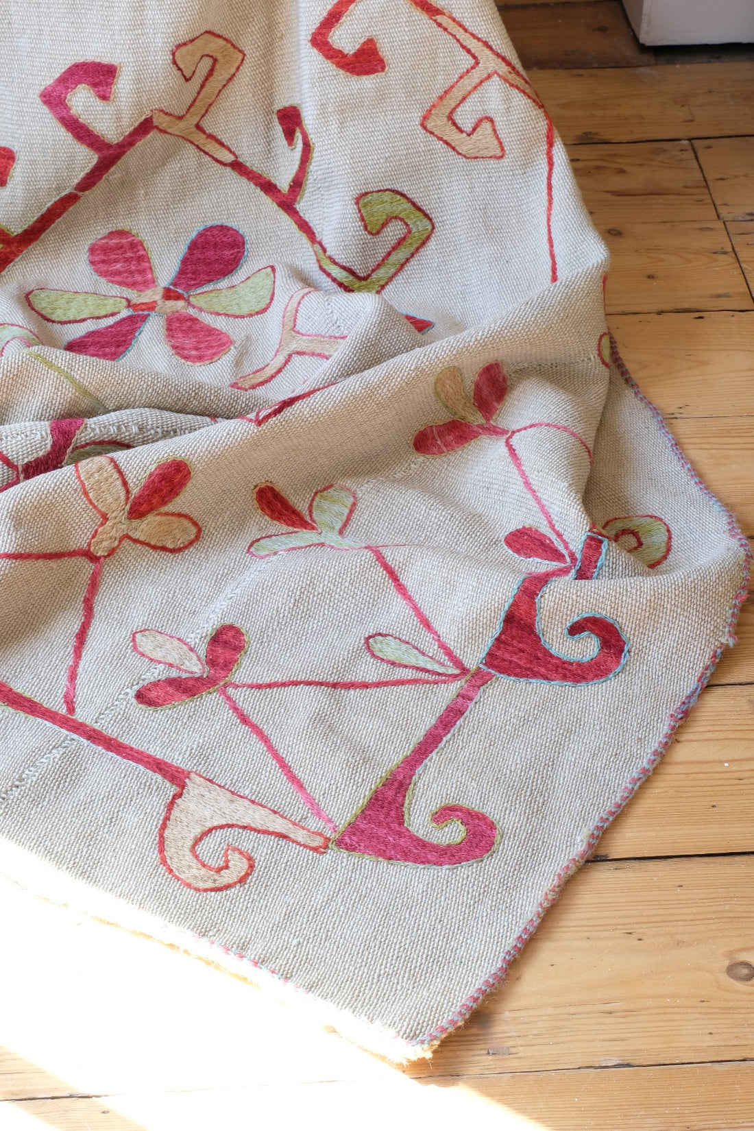 edge detail on a Large Uzbek Suzani embroidered textile silk on cotton floral lattice design