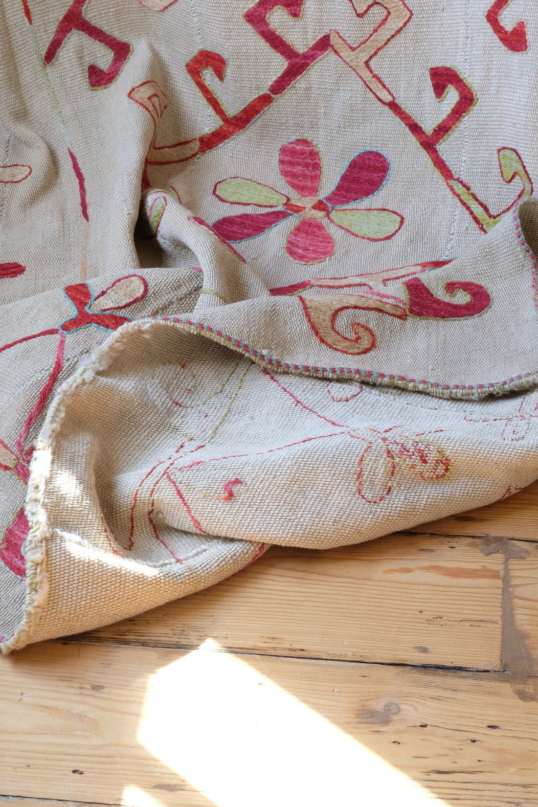 Back of a Large Uzbek Suzani embroidered textile silk on cotton floral lattice design