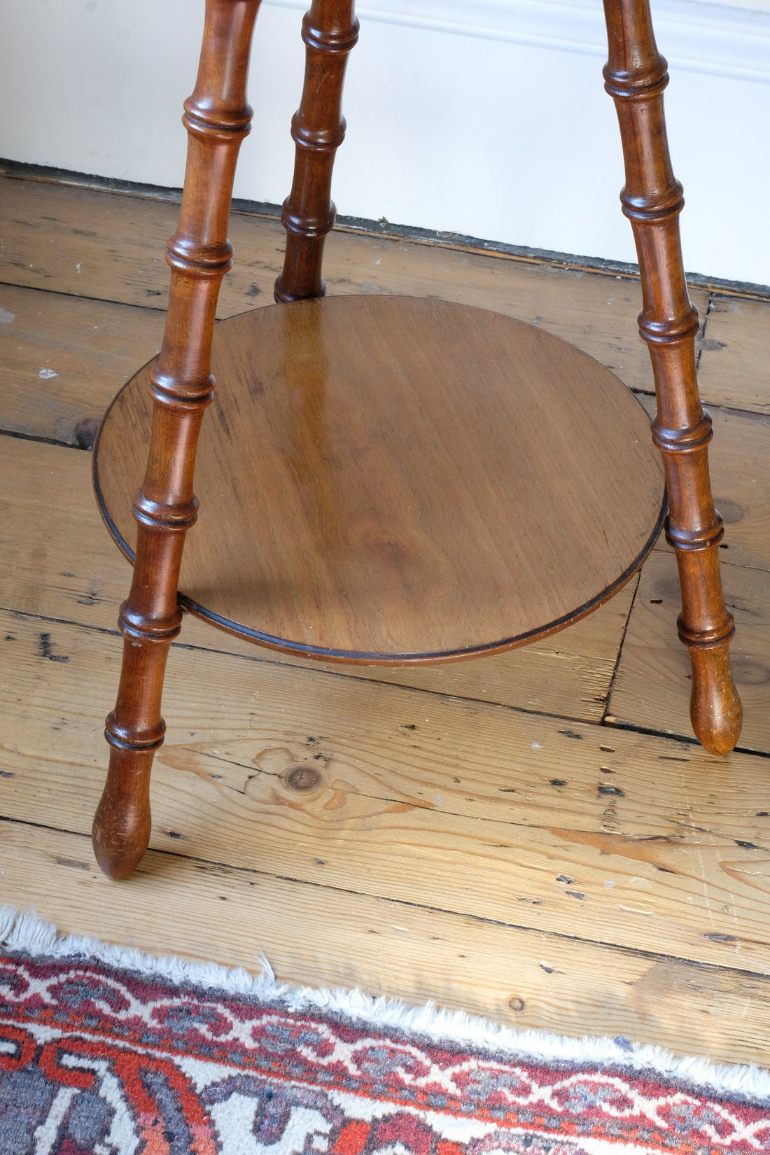 Bottom tier shelf - Victorian mahogany cricket table with faux bamboo legs and two-tone finish