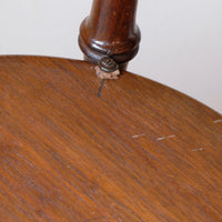Leather washer and original pencil mark to align the under tier and eye ley and screw o a Victorian mahogany cricket table with faux bamboo legs and two-tone finish