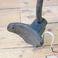 Curved back of the mounting plate on a 1930s Revo Tipton cast iron and copper swan neck street lamp
