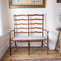 19th century English beech ladder-back bench with linen upholstered horsehair seat and waved slats