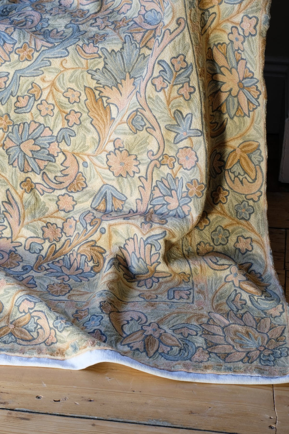 corner shot of a William Morris inspired Arts and Crafts chain stitch tapestry wall hanging textile panel