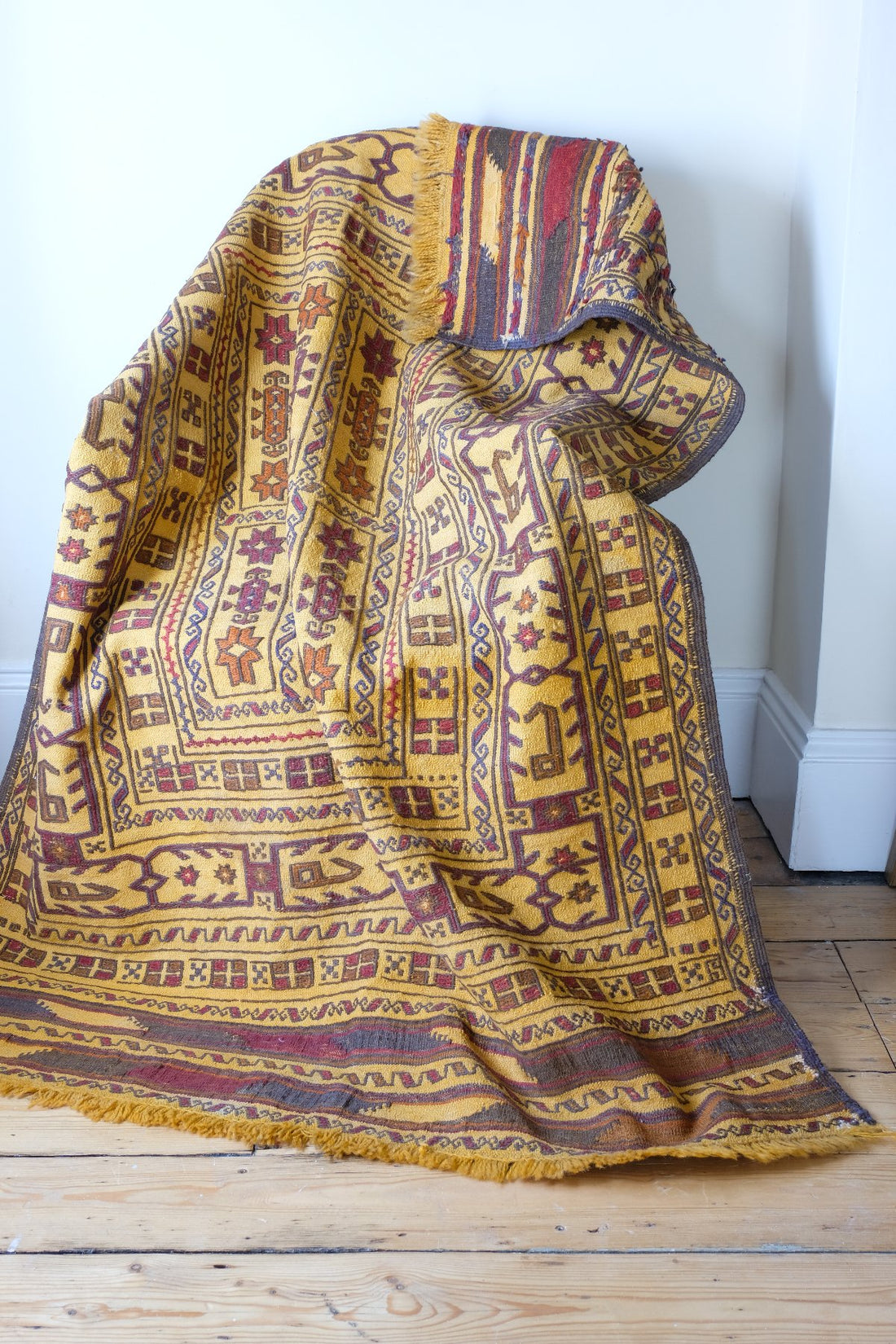 Antique Anatolian kilim rug with saffron ground and geometric motifs