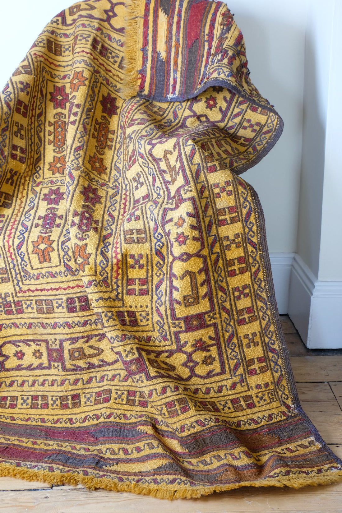 Antique Anatolian kilim rug with saffron ground and geometric motifs