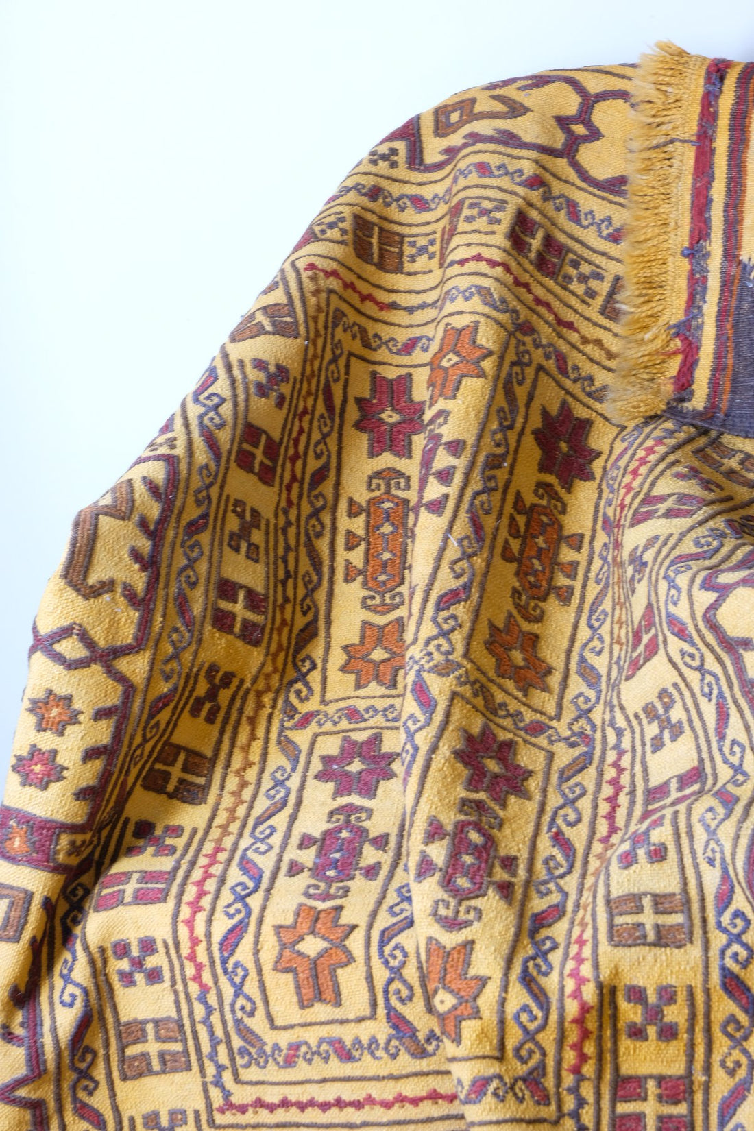 Antique Anatolian kilim rug with saffron ground and geometric motifs