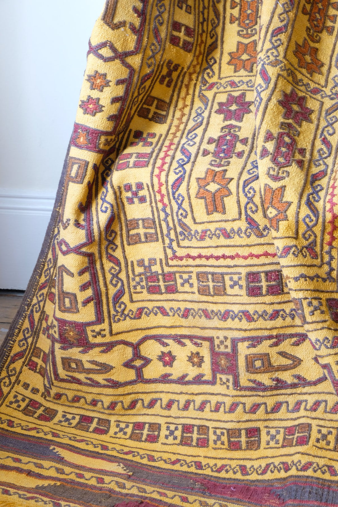 Antique Anatolian kilim rug with saffron ground and geometric motifs