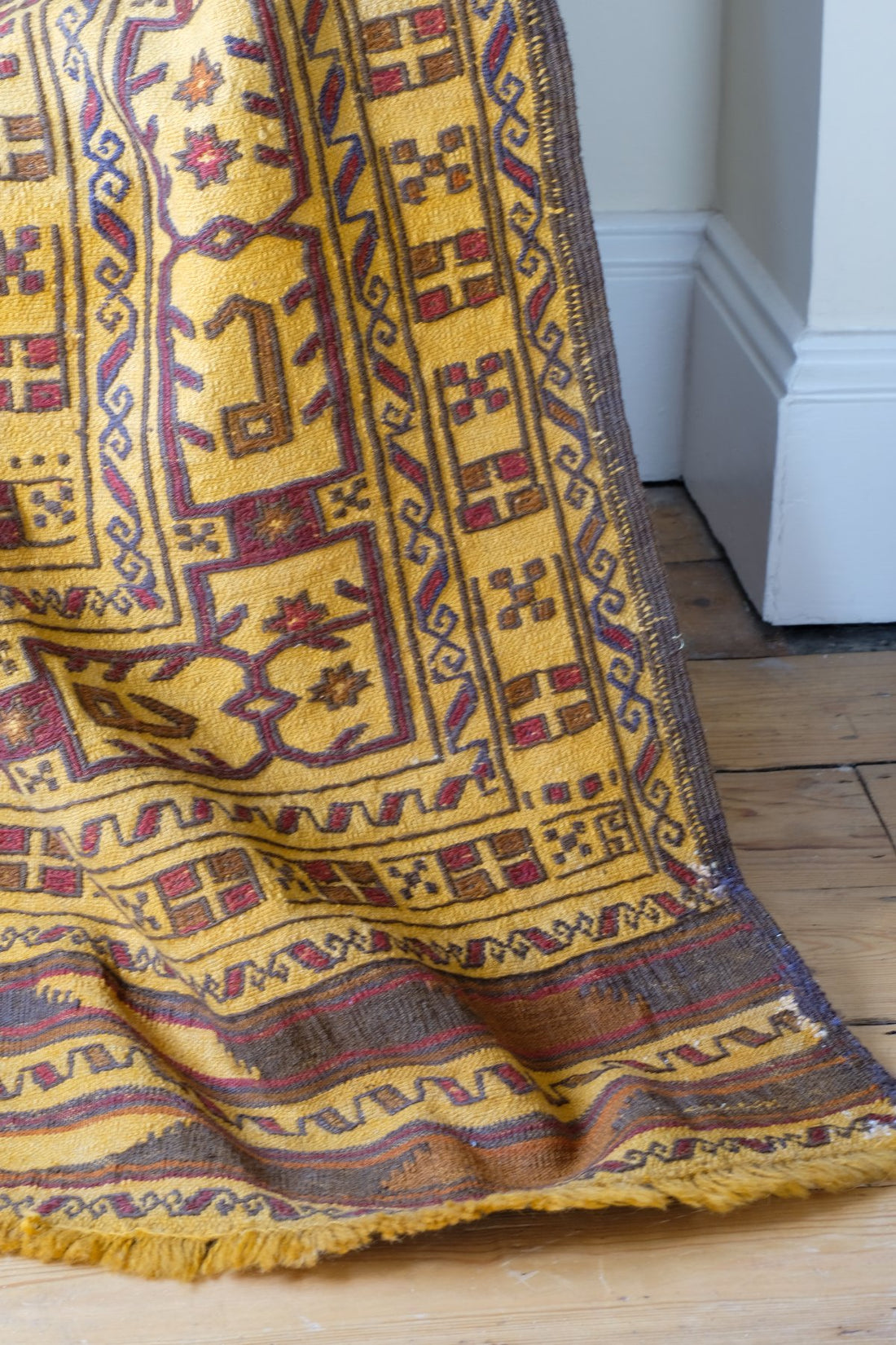 Antique Anatolian kilim rug with saffron ground and geometric motifs