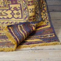 back of an Antique Anatolian kilim rug with saffron ground and geometric motifs