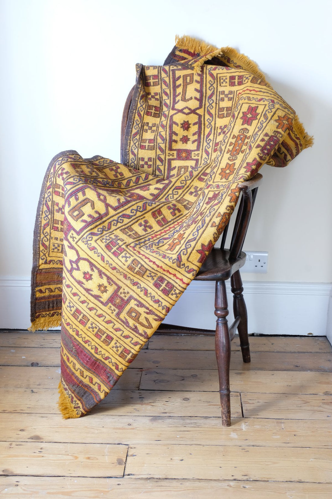 Antique Anatolian kilim rug with saffron ground and geometric motifs
