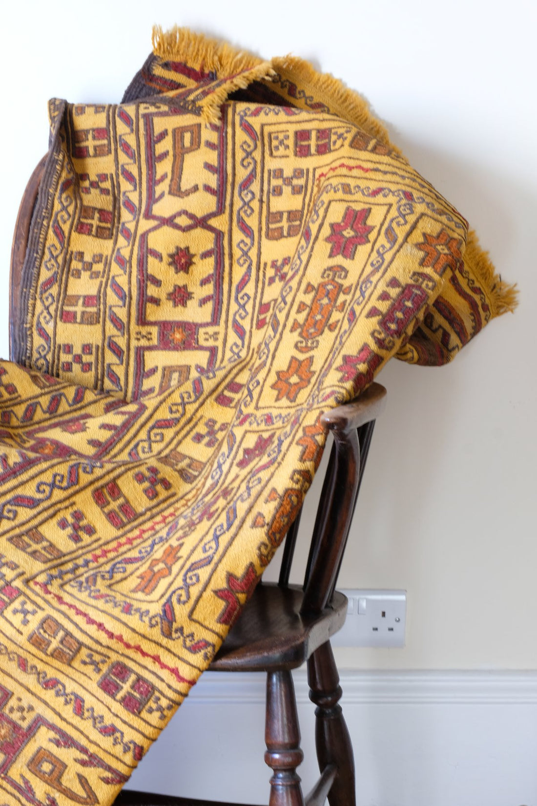 Antique Anatolian kilim rug with saffron ground and geometric motifs