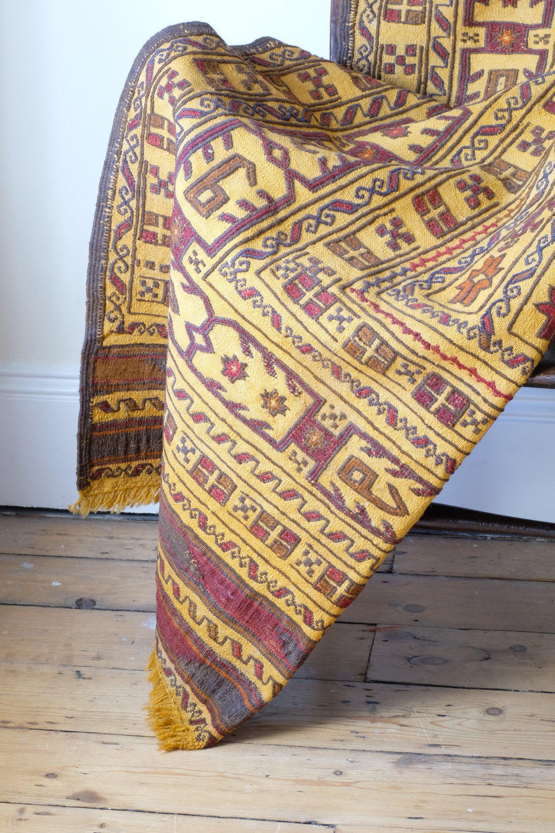Antique Anatolian kilim rug with saffron ground and geometric motifs