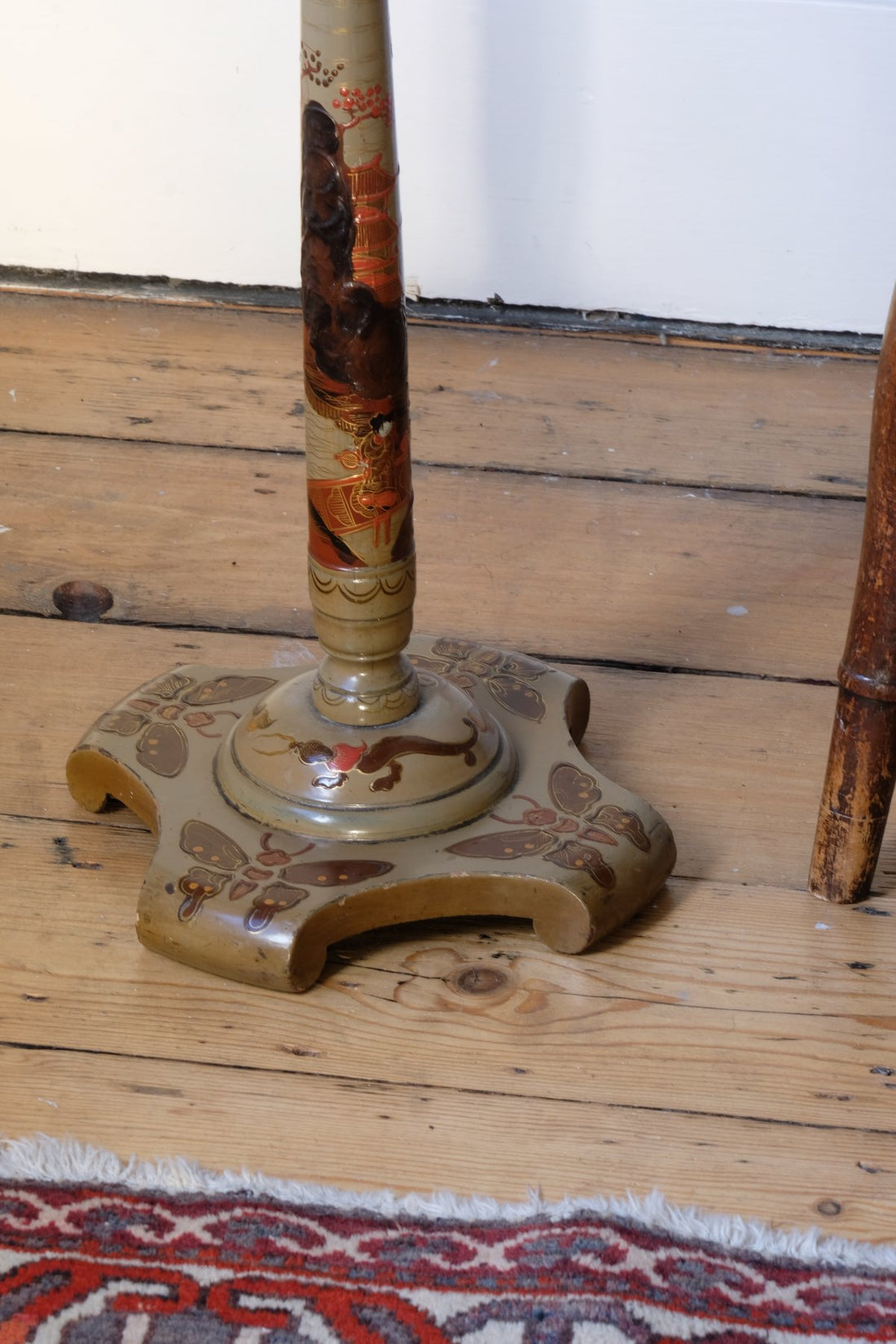 Pair of antique chinoiserie lacquered pedestal side tables with hand painted oriental scenes and gilt detailing