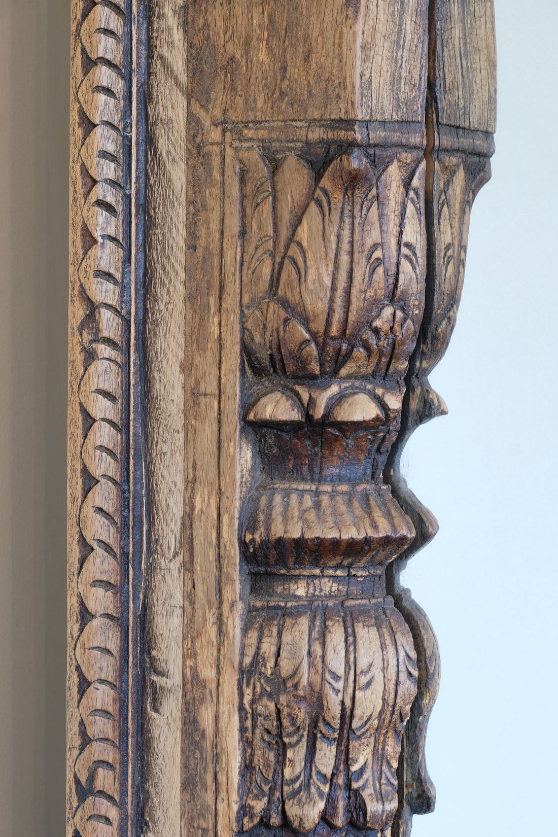 Frame detail on a large antique Indian carved hardwood mirror with Indo-Islamic Moorish arch detail