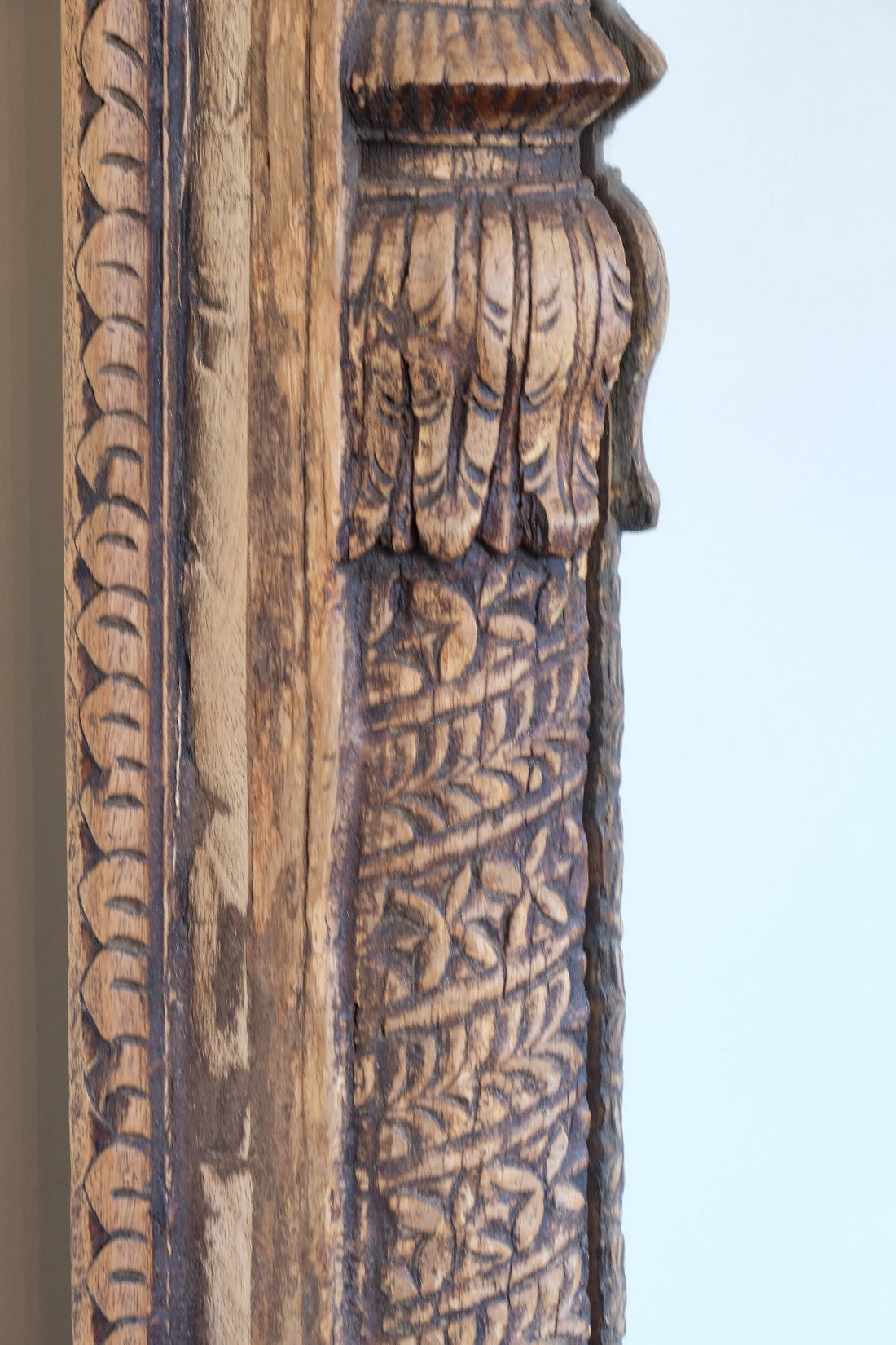 Close up detail o large antique Indian carved hardwood mirror with Indo-Islamic Moorish arch detail a 