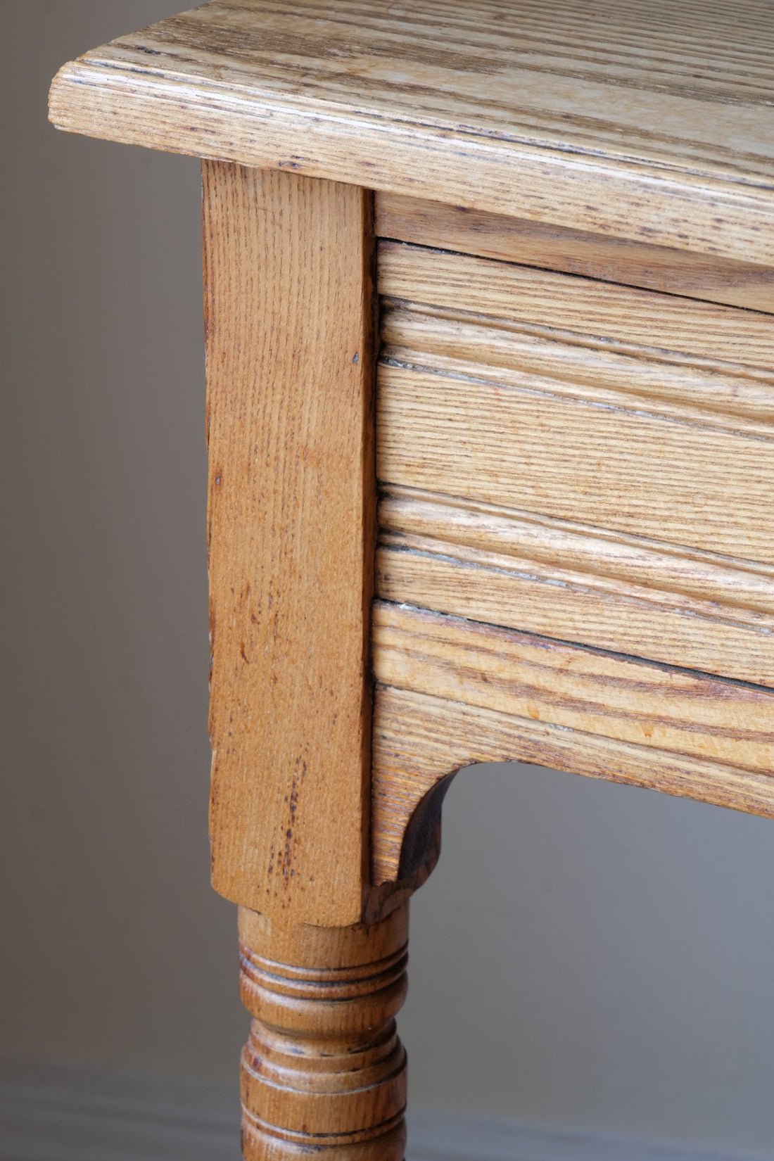Leg and drawer panel detail on an Antique Victorian ash side table Harrison and Son Blackburn with drawer and pot board