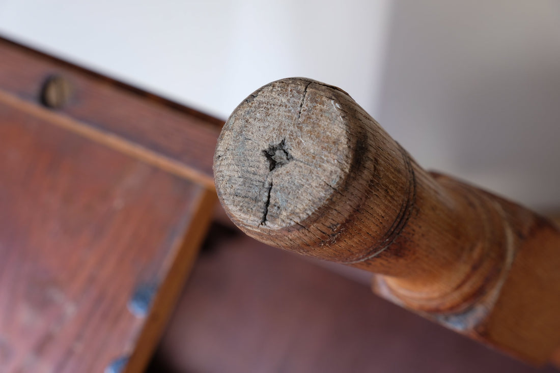 Bottom of he foot showing the wear on an Antique Victorian ash side table Harrison and Son Blackburn with drawer and pot board
