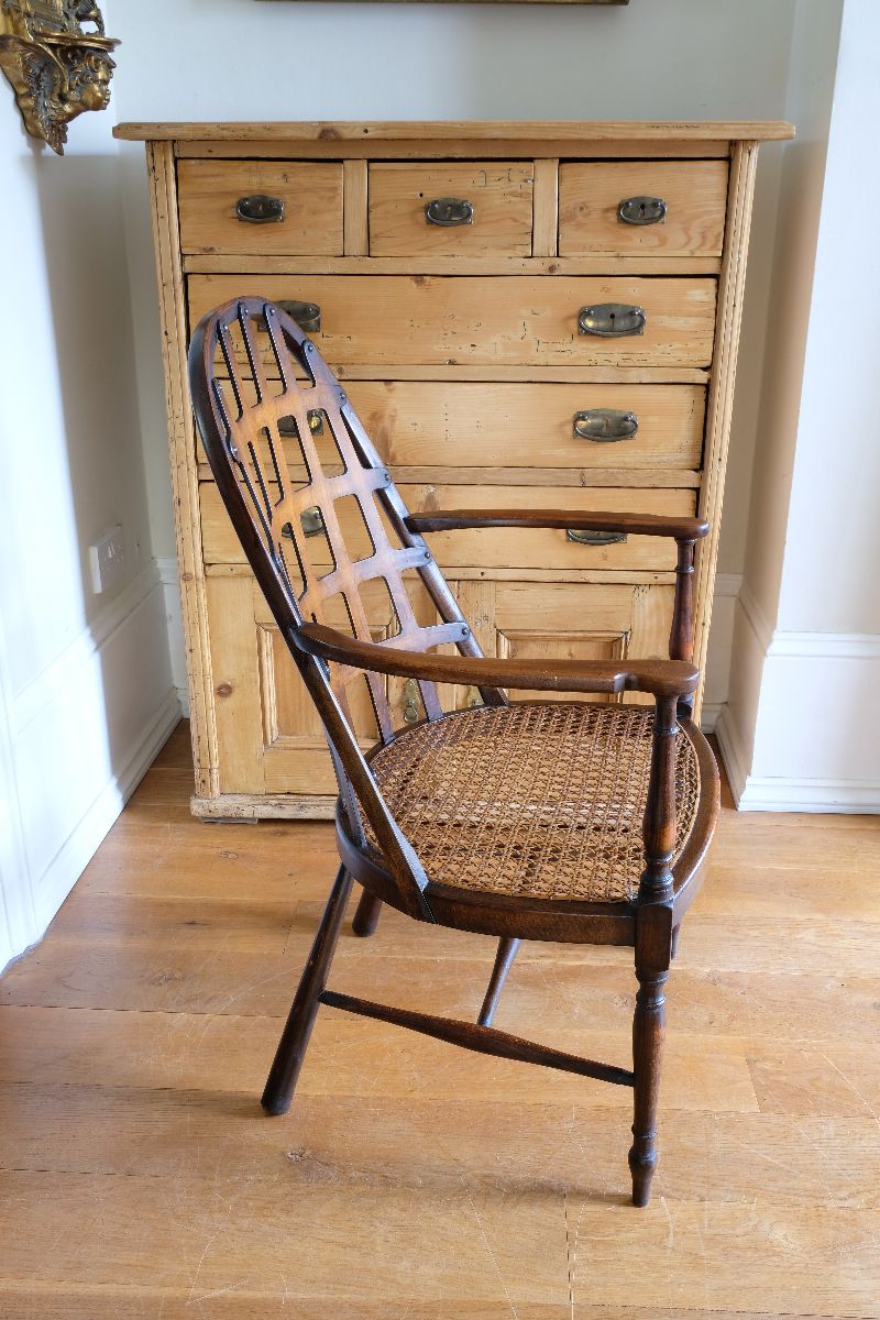 View of the curved back on a Rare Edwardian bentwood lattice back armchair attributed to Jas Shoolbred with pierced Arts & Crafts design