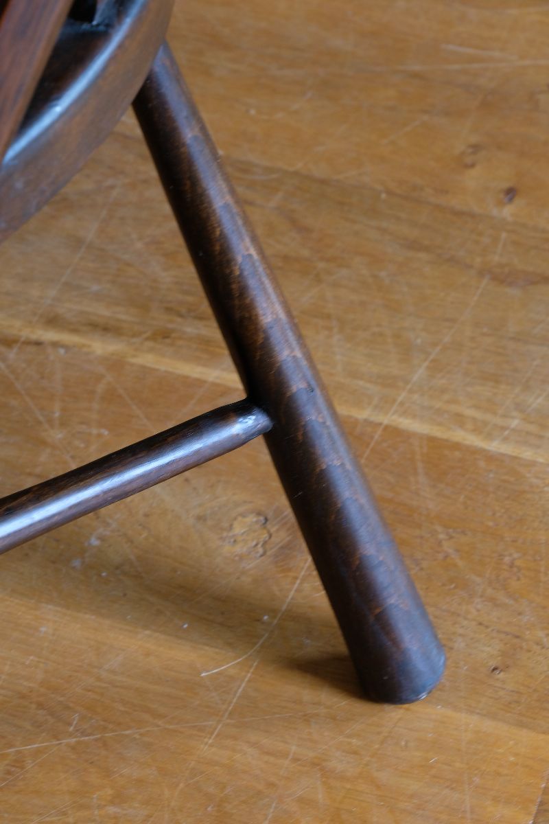 Wide tapered legs on a View of the cane seat on a Rare Edwardian bentwood lattice back armchair attributed to Jas Shoolbred with pierced Arts & Crafts design 