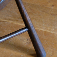Wide tapered legs on a View of the cane seat on a Rare Edwardian bentwood lattice back armchair attributed to Jas Shoolbred with pierced Arts & Crafts design 