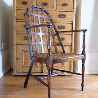 Low view on a Rare Edwardian bentwood lattice back armchair attributed to Jas Shoolbred with pierced Arts & Crafts design 