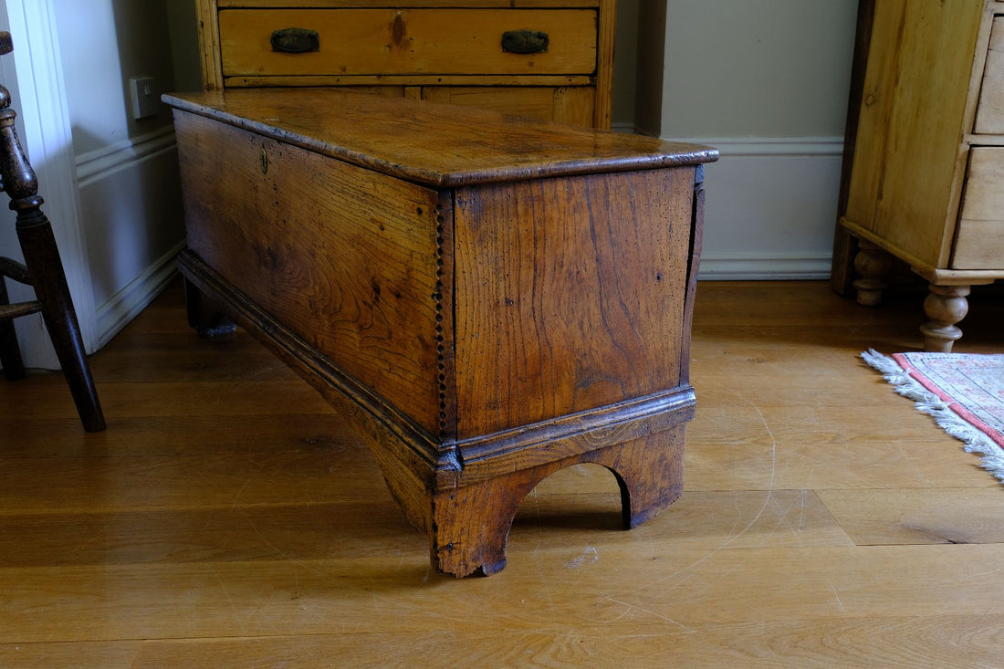 side view of an Early 19th Century English Elm Six Plank Coffer Chest With Internal Till