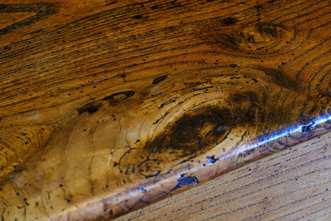 close up of the elm rich warm colour on an Early 19th Century English Elm Six Plank Coffer Chest With Internal Till