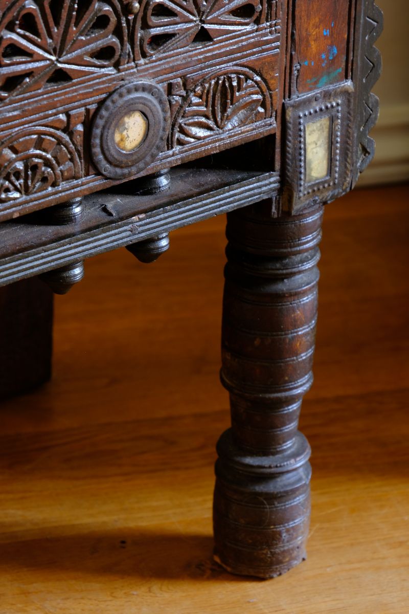 Turned legs on an Antique Kutch Damchiya dowry chest with mirror inlay and carved hardwood fretwork, Gujarat c.1900–1930