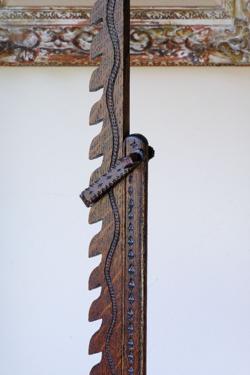 Serpentine carving of a snake on a Rare Arts & Crafts Carved Oak Ratchet Adjustable Candle Stand